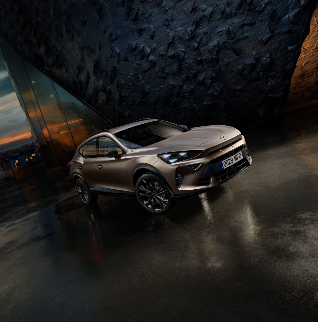 new cupra formentor offer, suv in century bronze matt, model year 2025, with 19 inch artic copper wheels and cityscape background. New car offers available.
